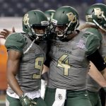 Baylor wide receiver KD Cannon (9) celebrates his touchdown catch with quarterback Zach Smith (4) during the first half of the Cactus Bowl NCAA college football game against Boise State, Tuesday, Dec. 27, 2016, in Phoenix. (AP Photo/Rick Scuteri)