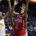 Arizona's Parker Jackson-Cartwright (0) shoots as California's Ivan Rabb defends during the first half of an NCAA college basketball game, Friday, Dec. 30, 2016, in Berkeley, Calif. (AP Photo/George Nikitin)