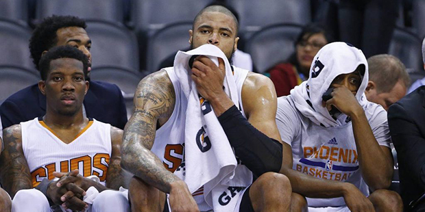 Phoenix Suns guard Eric Bledsoe, left, center Tyson Chandler, middle, and guard Brandon Knight, rig...