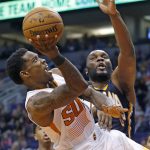 Phoenix Suns guard Eric Bledsoe, left, gets fouled as he goes up for a shot against Indiana Pacers center Al Jefferson, right, during the second half of an NBA basketball game Wednesday, Dec. 7, 2016, in Phoenix. The Pacers defeated the Suns 109-94. (AP Photo/Ross D. Franklin)