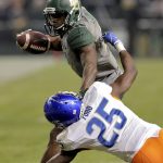 Baylor wide receiver KD Cannon (9) stiff-arms Boise State cornerback Raymond Ford (25) during the second half of the Cactus Bowl NCAA college football game, Tuesday, Dec. 27, 2016, in Phoenix. (AP Photo/Rick Scuteri)
