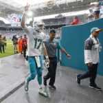 
              Miami Dolphins quarterback Ryan Tannehill (17) waves to fans as he is escorted off the field after he was injured, during the second half of an NFL football game against the Arizona Cardinals, Sunday, Dec. 11, 2016, in Miami Gardens, Fla. (AP Photo/Wilfredo Lee)
            
