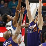 Phoenix Suns' Alex Len, right, of Ukraine, tries to block a shot by Minnesota Timberwolves' Andrew Wiggins during the first half of an NBA basketball game Monday, Dec. 19, 2016, in Minneapolis. (AP Photo/Jim Mone)