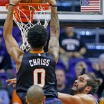 Phoenix Suns forward Marquese Chriss (0) dunks over New York Knicks center Joakim Noah, right, during the first half of an NBA basketball game, Tuesday, Dec. 13, 2016, in Phoenix. (AP Photo/Ross D. Franklin)