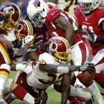 Washington Redskins running back Rob Kelley (32) scores a touchdown against the Arizona Cardinals during the second half of an NFL football game, Sunday, Dec. 4, 2016, in Glendale, Ariz. (AP Photo/Ross D. Franklin)