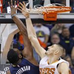 Phoenix Suns center Alex Len, right, blocks the shot of Indiana Pacers center Al Jefferson (7) during the second half of an NBA basketball game, Wednesday, Dec. 7, 2016, in Phoenix. The Pacers defeated the Suns 109-94. (AP Photo/Ross D. Franklin)