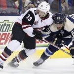 Arizona Coyotes' Alex Goligoski, left, and Columbus Blue Jackets' Brandon Saad fight for a loose puck during the second period of an NHL hockey game Monday, Dec. 5, 2016, in Columbus, Ohio. (AP Photo/Jay LaPrete)