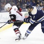 Arizona Coyotes' Max Domi, left, and Columbus Blue Jackets' Jack Johnson fight for the puck during the first period of an NHL hockey game, Monday, Dec. 5, 2016, in Columbus, Ohio. (AP Photo/Jay LaPrete)