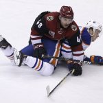 Arizona Coyotes left wing Jordan Martinook (48) holds down Edmonton Oilers center Connor McDavid in the second period during an NHL hockey game, Wednesday, Dec. 21, 2016, in Glendale, Ariz. (AP Photo/Rick Scuteri)