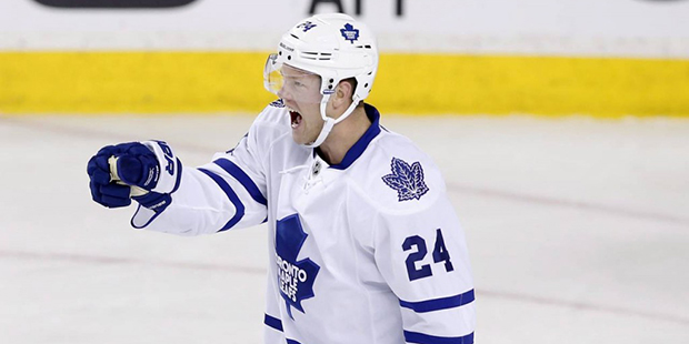 Toronto Maple Leafs' Peter Holland celebrates his goal against the Calgary Flames during first peri...