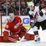 Arizona Coyotes right wing Shane Doan, right, watches an Anthony DeAngelo shot score on Detroit Red Wings goalie Jimmy Howard (35) in the first period of an NHL hockey game, Tuesday, Dec. 13, 2016, in Detroit. (AP Photo/Paul Sancya)