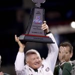 Baylor head coach Jim Grobe holds the winners' trophy after he Cactus Bowl NCAA college football game against Boise State, Tuesday, Dec. 27, 2016, in Phoenix. Baylor won 31-12. (AP Photo/Matt York)