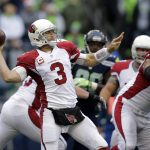 Arizona Cardinals quarterback Carson Palmer (3) throws a touchdown pass agianst the Seattle Seahawks in the first half of an NFL football game, Saturday, Dec. 24, 2016, in Seattle. (AP Photo/John Froschauer)