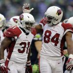 Arizona Cardinals' David Johnson (31) is congratulated by Jermaine Gresham after scoring against the Seattle Seahawks in the second half of an NFL football game, Saturday, Dec. 24, 2016, in Seattle. (AP Photo/John Froschauer)