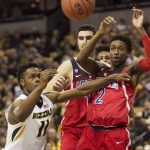 Missouri's K.J. Walton, left, pushes away Arizona's Kobi Simmons, right, as Dusan Ristic, center, looks on during the first half of an NCAA college basketball game Saturday, Dec. 10, 2016, in Columbia, Mo. (AP Photo/L.G. Patterson)