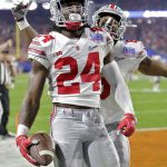 Ohio State safety Malik Hooker (24) celebrates his interception against Clemson with teammate Gareon Conley during the first half of the Fiesta Bowl NCAA college football playoff semifinal, Saturday, Dec. 31, 2016, in Glendale, Ariz. (AP Photo/Rick Scuteri)