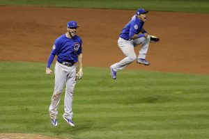FILE - In this Nov. 2, 2016 file photo, Chicago Cubs' Kris Bryant, left, and Addison Russell, begin to celebrate after the final out of Game 7 of the Major League Baseball World Series against the Cleveland Indians, in Cleveland. Chicago won 8-7 in ten innings. (AP Photo/Gene J. Puskar, File)