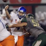 Boise State quarterback Brett Rypien (4) is hit by Baylor defensive end Greg Roberts (52) as he throws during the first half of the Cactus Bowl NCAA college football game, Tuesday, Dec. 27, 2016, in Phoenix. (AP Photo/Rick Scuteri)