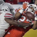 Clemson running back C.J. Fuller (27) pulls in a touchdown pass as Ohio State cornerback C.J. Saunders, left, defends during the first half of the Fiesta Bowl NCAA college football playoff semifinal, Saturday, Dec. 31, 2016, in Glendale, Ariz. (AP Photo/Rick Scuteri)