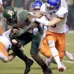 Baylor running back Terence Williams is tackled by Boise State safety Kekoa Nawahine (10) and linebacker Blake Whitlock, left, during the first half of the Cactus Bowl NCAA college football game, Tuesday, Dec. 27, 2016, in Phoenix. (AP Photo/Matt York)
