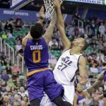Utah Jazz center Rudy Gobert (27) blocks the shot of Phoenix Suns forward Marquese Chriss (0) in the first half of an NBA basketball game, Tuesday, Dec. 6, 2016, in Salt Lake City. (AP Photo/Rick Bowmer)