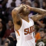 Phoenix Suns forward P.J. Tucker reacts to a foul call against him during the second half of the team's NBA basketball game against the Houston Rockets, Wednesday, Dec. 21, 2016, in Phoenix. (AP Photo/Matt York)
