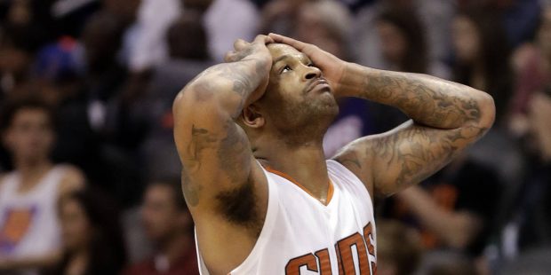 Phoenix Suns forward P.J. Tucker reacts to a foul call against him during the second half of the te...