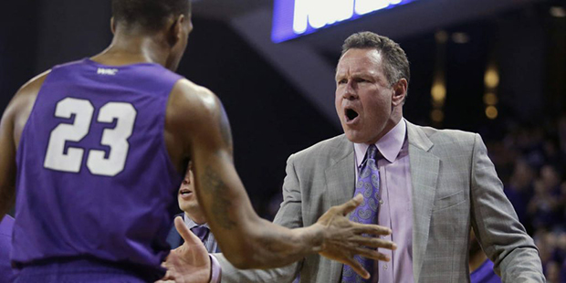 Grand Canyon head coach Dan Majerle celebrates with Darion Clark (23) during a timeout in the first...