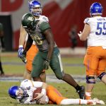 Baylor defensive end Tyrone Hunt (90) stands over Boise State quarterback Brett Rypien (4) after a sack during the second half of the Cactus Bowl NCAA college football game, Tuesday, Dec. 27, 2016, in Phoenix. Baylor won 31-12. (AP Photo/Rick Scuteri)