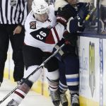 Arizona Coyotes' Michael Stone, left, checks Columbus Blue Jackets' Josh Anderson during the second period of an NHL hockey game Monday, Dec. 5, 2016, in Columbus, Ohio. (AP Photo/Jay LaPrete)