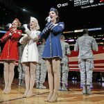 The Victory Belles from the World War II Museum perform the national anthem on Military Appreciation Night prior to an NBA basketball game between the Phoenix Suns and the Indiana Pacers Wednesday, Dec. 7, 2016, in Phoenix. (AP Photo/Ross D. Franklin)