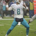 Miami Dolphins quarterback Matt Moore (8) look to pass under heavy rain, during the second half of an NFL football game against the Arizona Cardinals, Sunday, Dec. 11, 2016, in Miami Gardens, Fla. Moore replaced Tannehill who was injured during the game. The Dolphins defeated the Cardinals 26-23. (AP Photo/Wilfredo Lee)