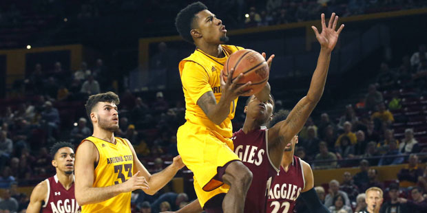 Arizona State's Shannon Evans II, center, shoots during an NCAA college basketball game against New...