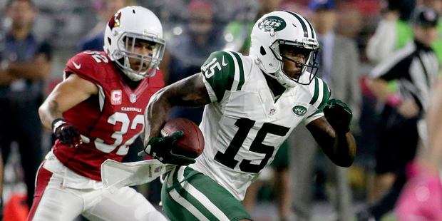 New York Jets wide receiver Brandon Marshall (15) makes a catch as Arizona Cardinals free safety Ty...