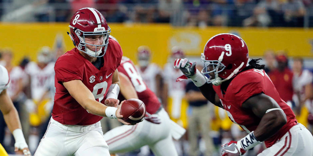 Alabama quarterback Blake Barnett (8) hands off to running back Bo Scarbrough, right, as Southern C...