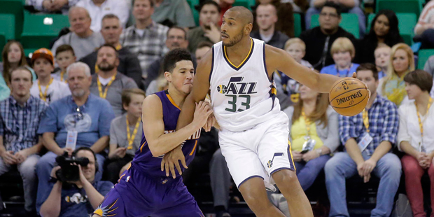Phoenix Suns guard Devin Booker (1) defends against Utah Jazz center Boris Diaw (33) in the first h...