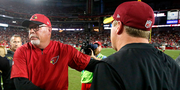 Arizona Cardinals head coach Bruce Arians greets Washington Redskins head coach Jay Gruden after an...