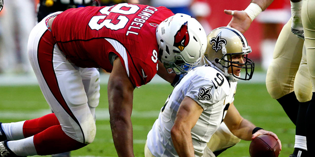 New Orleans Saints quarterback Drew Brees (9) is sacked by Arizona Cardinals defensive end Calais C...