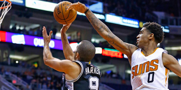 Phoenix Suns forward Marquese Chriss (0) blocks the shot of San Antonio Spurs guard Tony Parker (9)...