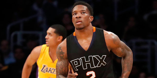 Phoenix Suns guard Eric Bledsoe, right, runs down the court after making a three-point basket over ...