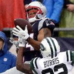 New England Patriots wide receiver Michael Floyd (14) catches a pass as New York Jets cornerback Juston Burris (32) defends during the first half of an NFL football game, Saturday, Dec. 24, 2016, in Foxborough, Mass. (AP Photo/Charles Krupa)