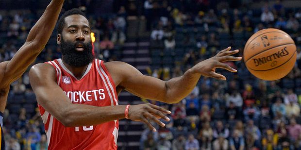 Houston Rockets guard James Harden, right, passes while defended by Memphis Grizzlies guard Tony Al...