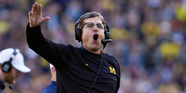 Michigan head coach Jim Harbaugh reacts to the results of an official's review in the second quarte...