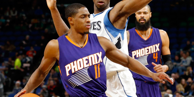 Phoenix Suns' Brandon Knight,left, works around Minnesota Timberwolves' Andrew Wiggins during the f...