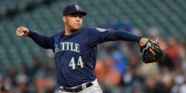 Seattle Mariners pitcher Taijuan Walker throws a pitch to the Baltimore Orioles, as rain falls duri...