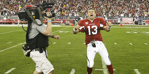 Arizona Cardinals quarterback Kurt Warner celebrates after overtime of an NFL wild-card playoff foo...