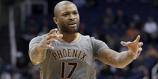 Phoenix Suns forward P.J. Tucker (17) reacts to a foul called against him during the first half of ...