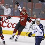 Arizona Coyotes left wing Brendan Perlini (29) celebrates a goal, his second during the first period of an NHL hockey game, with defenseman Oliver Ekman-Larsson (23) as Winnipeg Jets center Adam Lowry (17) skates away from the celebration Friday, Jan. 13, 2017, in Glendale, Ariz. (AP Photo/Ross D. Franklin)
