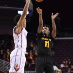 Arizona State guard Shannon Evans II, right, shoots as Southern California guard Jordan McLaughlin defends during the first half of an NCAA college basketball game, Sunday, Jan. 22, 2017, in Los Angeles. (AP Photo/Mark J. Terrill)