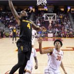 Arizona State guard Torian Graham, left, shoots as Southern California guard Elijah Stewart defends during the second half of an NCAA college basketball game, Sunday, Jan. 22, 2017, in Los Angeles. USC won 82-79. (AP Photo/Mark J. Terrill)